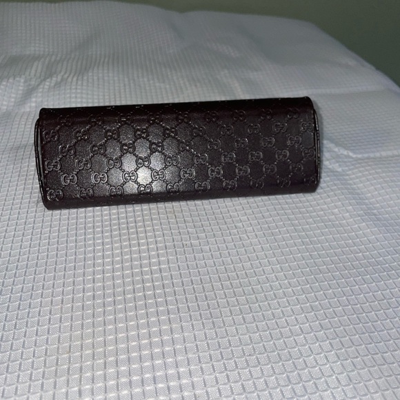 brown leather monogrammed foldable eyeglasses case from Gucci. - Picture 6 of 16